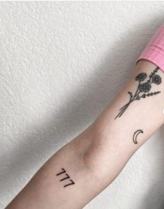 777 Tattoo: Symbolism & Cool Ideas - Tattoo Twist